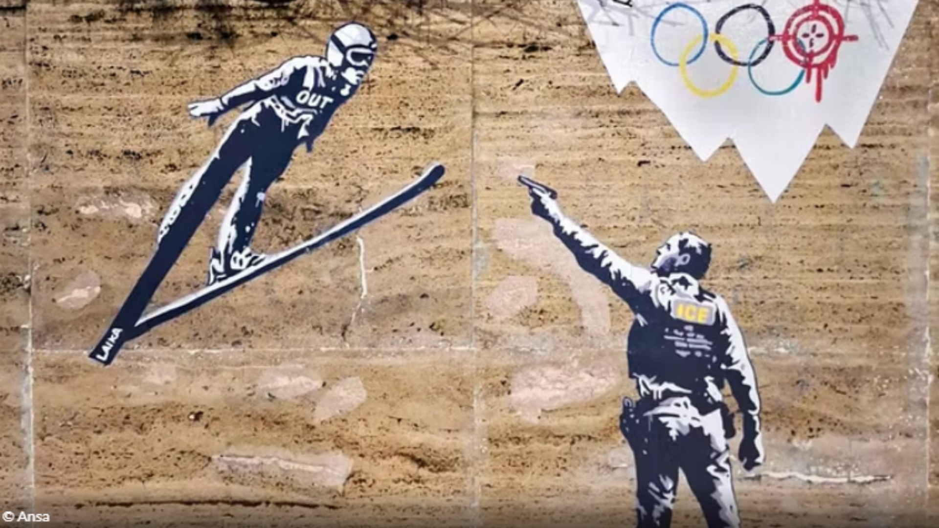 Lojërat Olimpike Dimërore  provokimi i artistit të rrugës  agjenti i ICE qëllon me armë një skiator