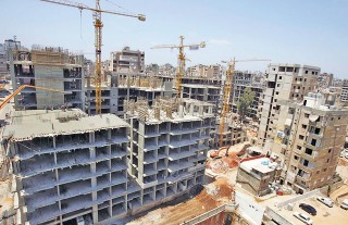 View of residential buildings damaged during war as they undergo reconstruction in suburbs of Beirut