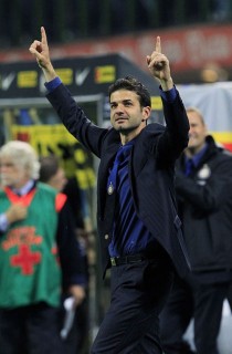 Inter Milan's coach Andrea Stramaccioni celebrates after defeating AC Milan in their Italian Serie A soccer match in Milan
