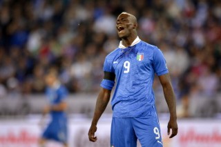 Italy's forward Mario Balotelli reacts a