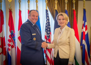 Mrs. Mimi Kodheli and General Philip M. Breedlove shake hands after the signing protocol.